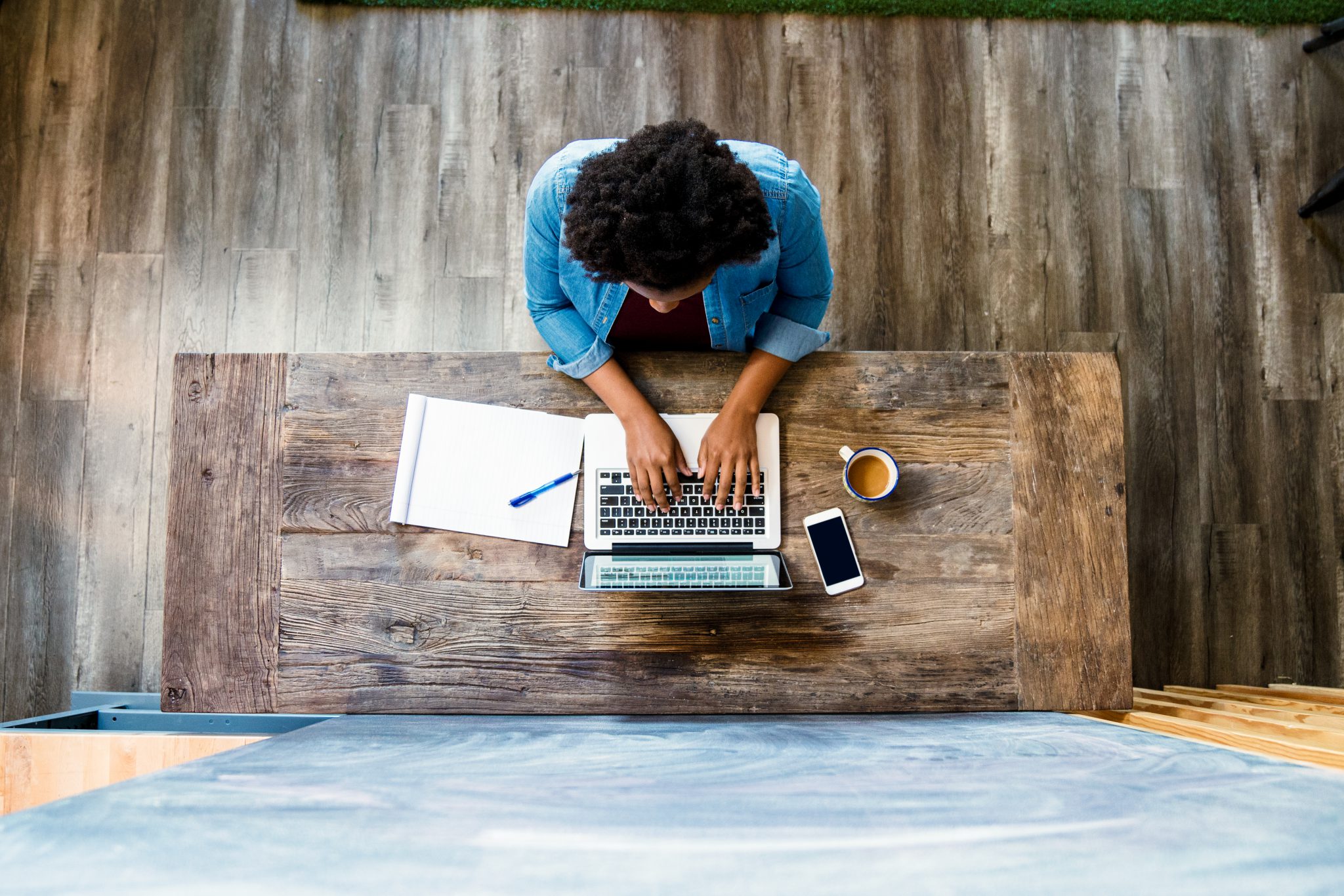 Overhead view of a woman using a computer Digital Resolve